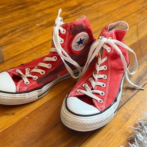 worn down red high top converse